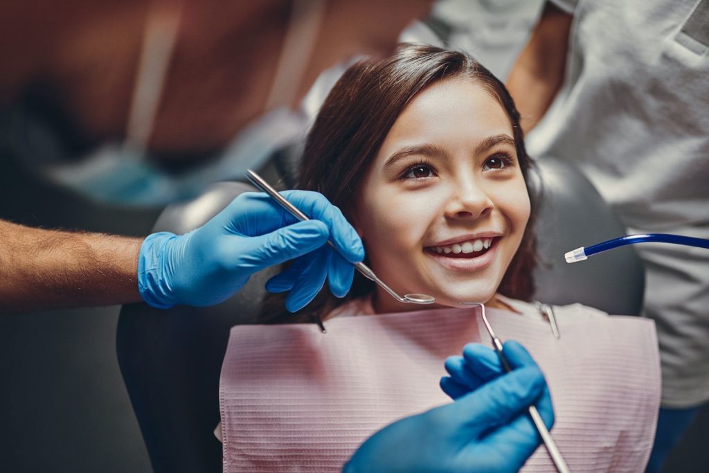 cute little girl at the dentist getting teeth cleaned family dentistry dentist in Alpharetta Georgia